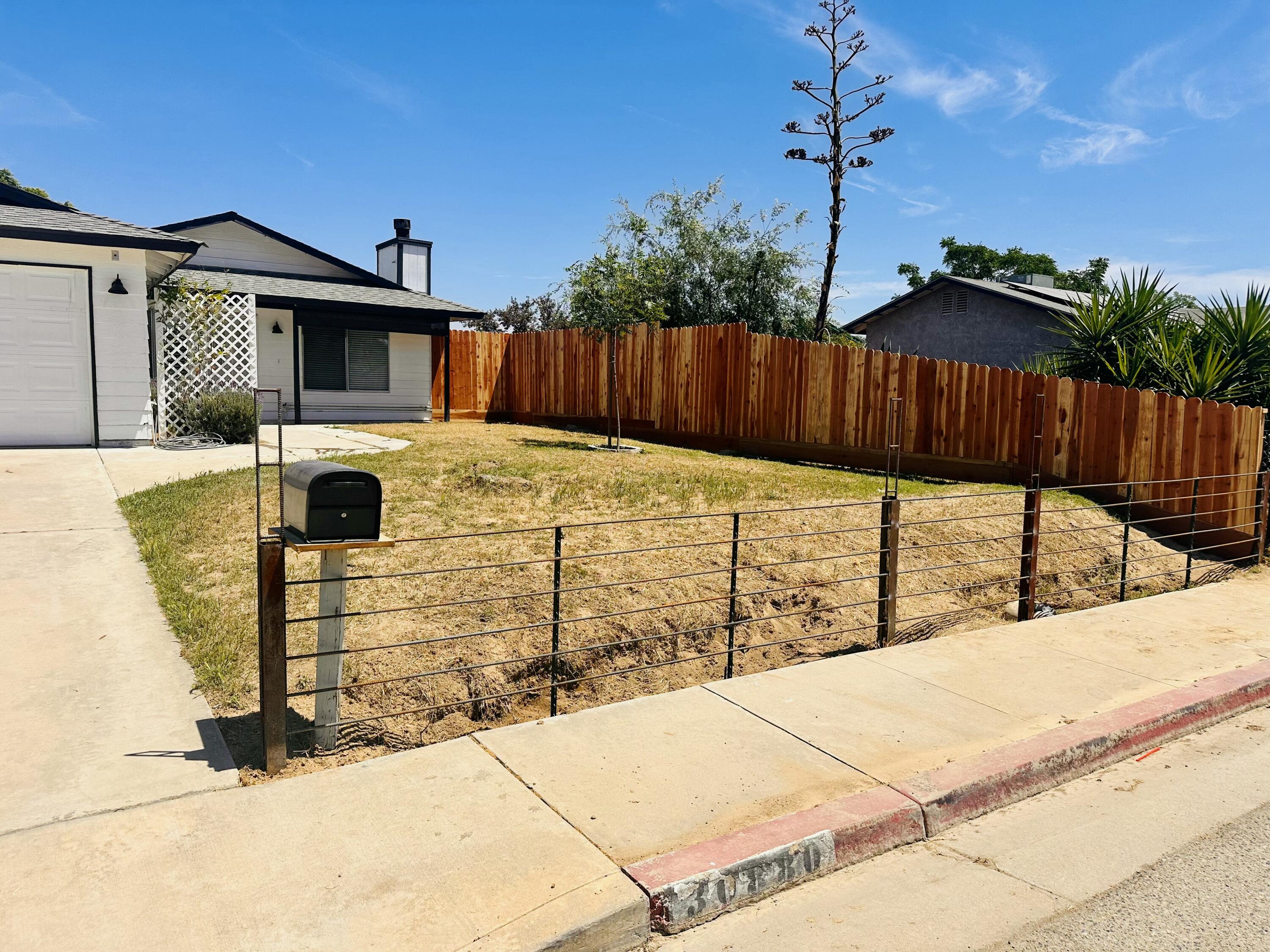 30880 Farr Road Visalia, CA 93291 - Photo 3 of 27 a view of a backyard of the house