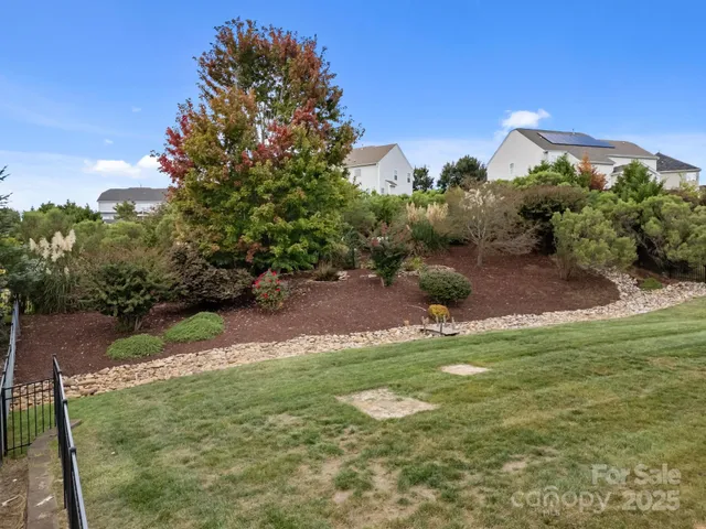 a backyard of a house with lots of green space