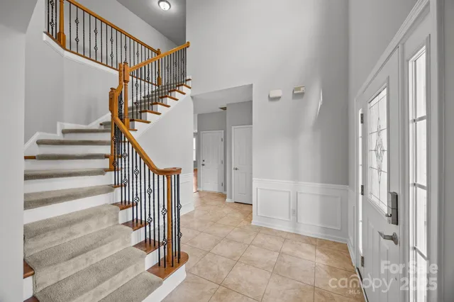 a view of entryway with wooden floor and stairs