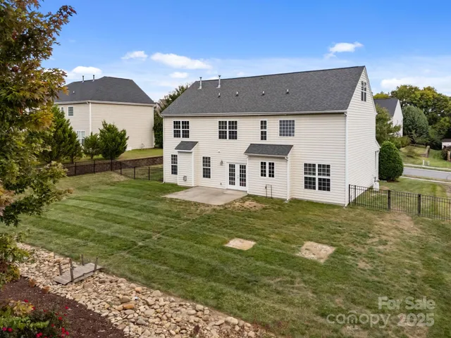 an aerial view of a house with a garden
