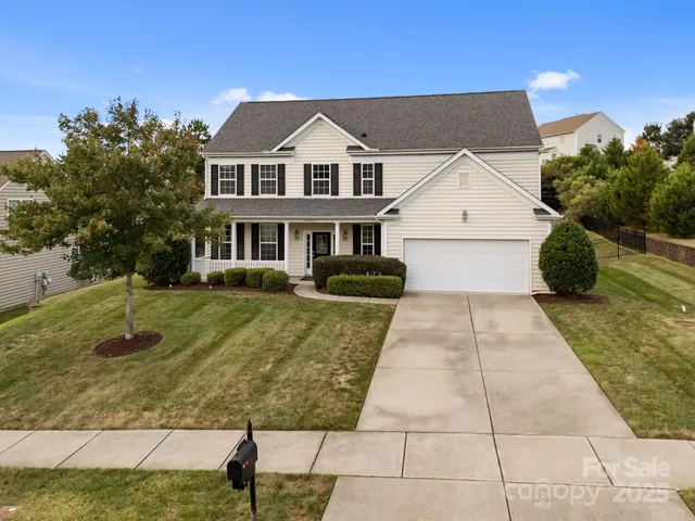 an aerial view of a house with outdoor space patio and mountain view