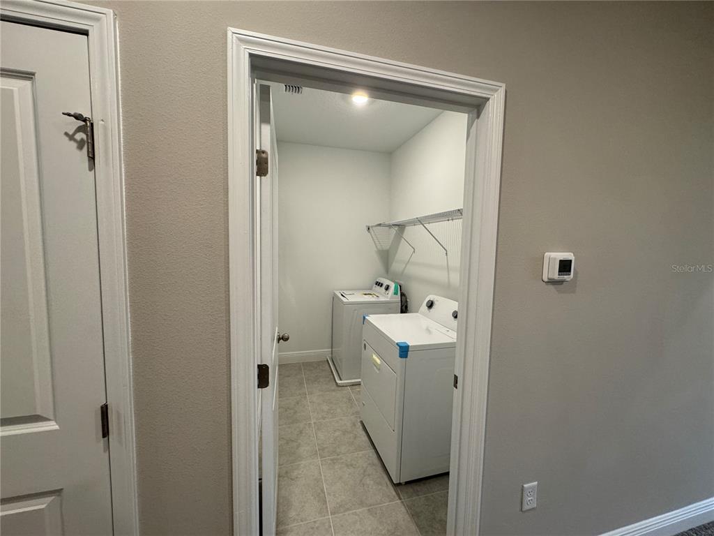 16434 Hamlin Hills Road Winter Garden, FL 34787 - Photo 21 of 50 a bathroom with a sink and mirror
