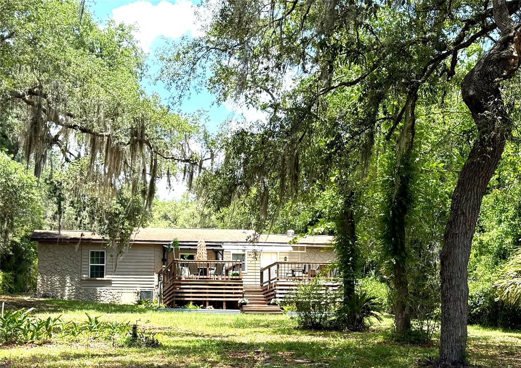 208 Ashley Street Hawthorne, FL 32640 - Photo 29 of 32 a front view of a house with a yard