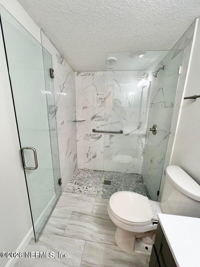 1961 New Haven Road Jacksonville, FL 32211 - Photo 19 of 53 a bathroom with a toilet and a shower