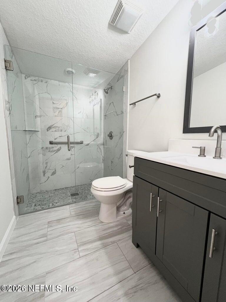 1961 New Haven Road Jacksonville, FL 32211 - Photo 21 of 53 a bathroom with a sink a toilet and shower