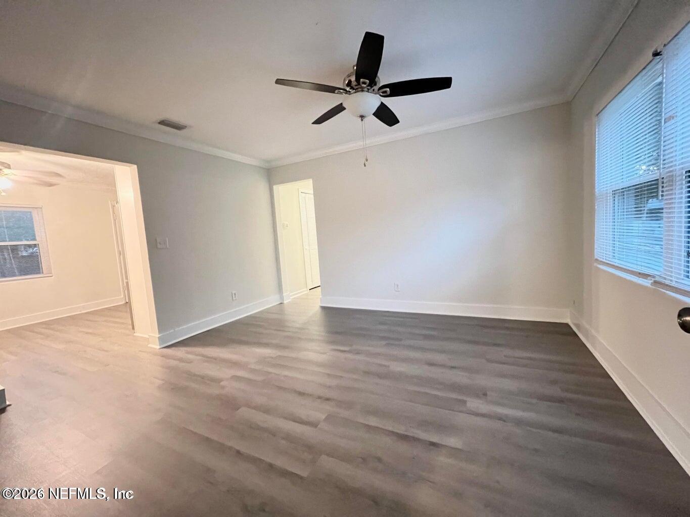 1961 New Haven Road Jacksonville, FL 32211 - Photo 26 of 53 a view of an empty room with wooden floor and a window