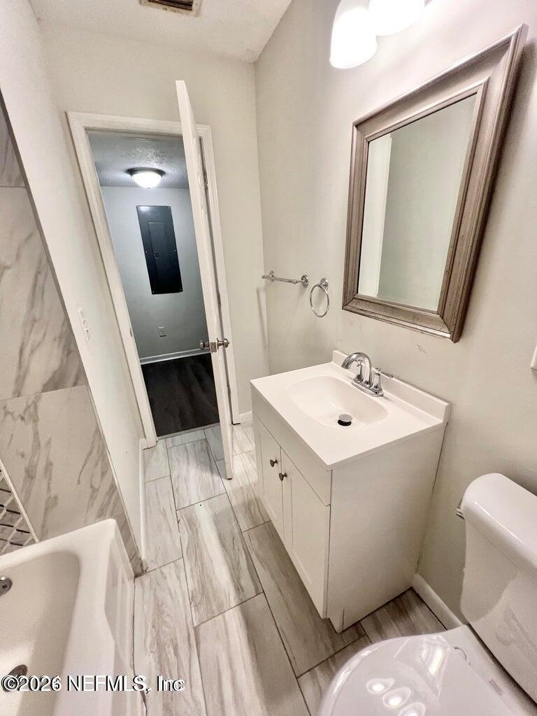 1961 New Haven Road Jacksonville, FL 32211 - Photo 36 of 53 a bathroom with a sink toilet and mirror
