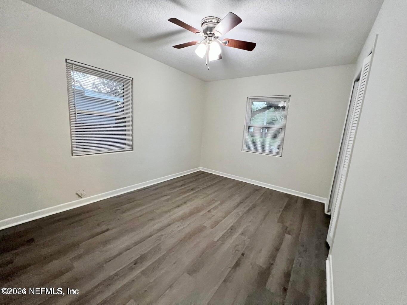 1961 New Haven Road Jacksonville, FL 32211 - Photo 40 of 53 a view of an empty room with a window and wooden floor