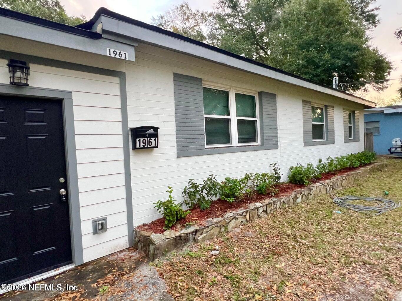 1961 New Haven Road Jacksonville, FL 32211 - Photo 4 of 53 a front view of a house with garden