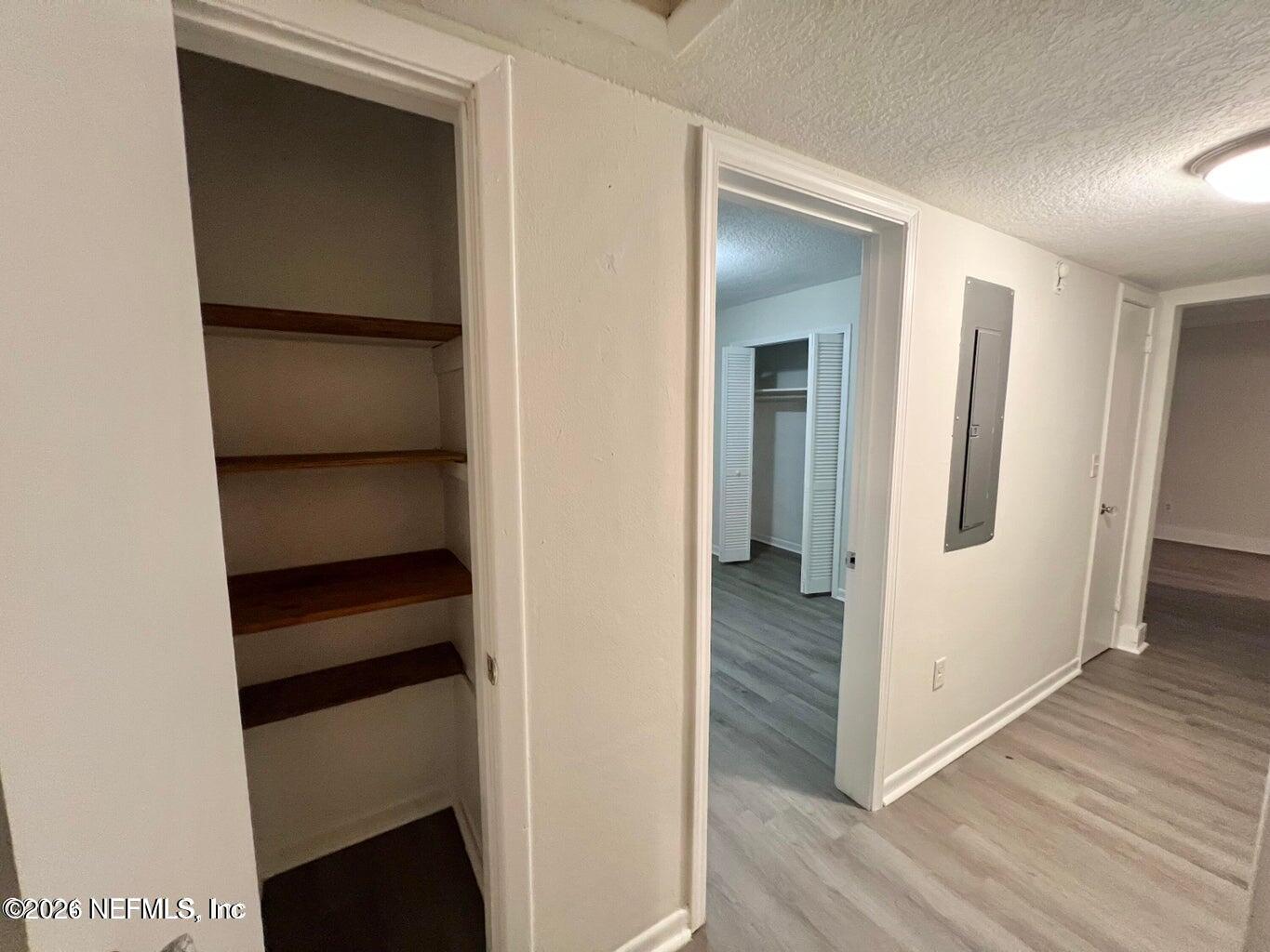 1961 New Haven Road Jacksonville, FL 32211 - Photo 41 of 53 a view of walk in closet with wooden floor