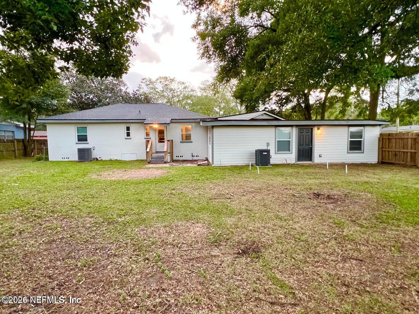 1961 New Haven Road Jacksonville, FL 32211 - Photo 45 of 53 a house view with a garden and trees