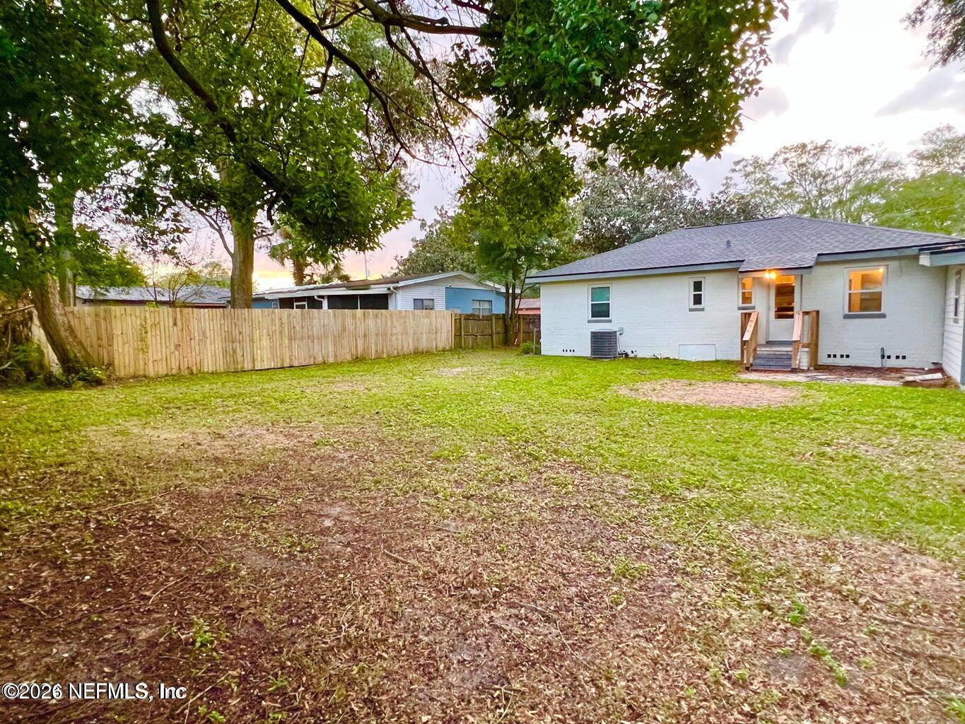 1961 New Haven Road Jacksonville, FL 32211 - Photo 47 of 53 a view of a house with a yard and a large tree