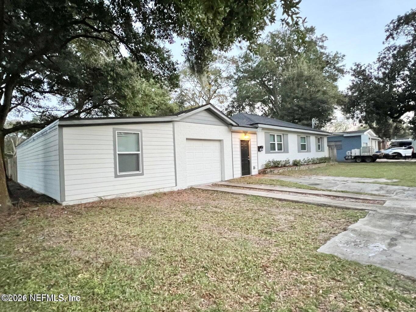 1961 New Haven Road Jacksonville, FL 32211 - Photo 53 of 53 a house with trees in the background