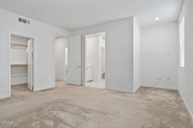 a view of a kitchen with a sink and dishwasher a refrigerator with wooden floor