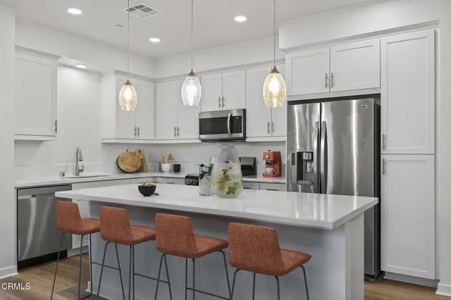 a bedroom with a bed and a potted plant