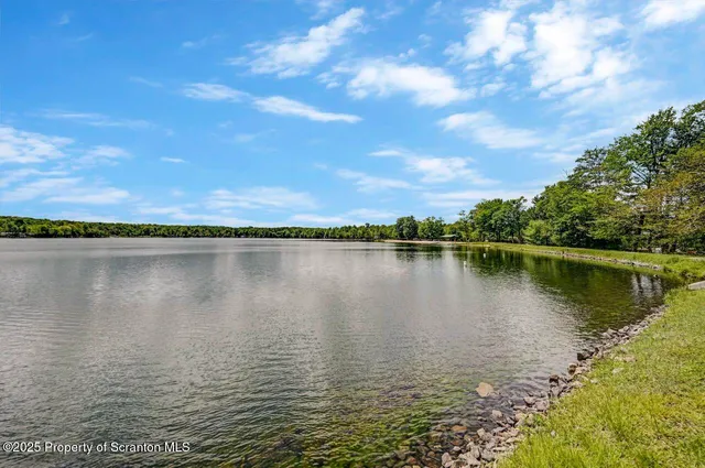 a kitchen with stainless steel appliances granite countertop a stove sink and cabinets