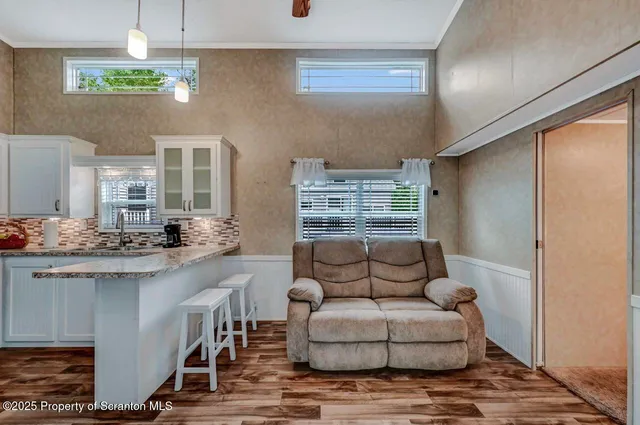 a kitchen with stainless steel appliances granite countertop a sink and stove