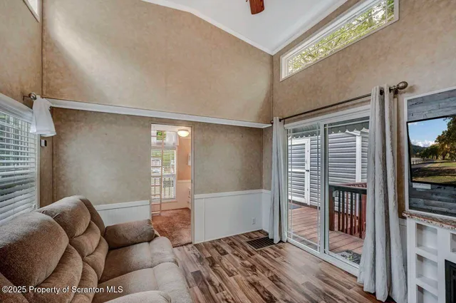 a view of balcony with wooden floor and outdoor space