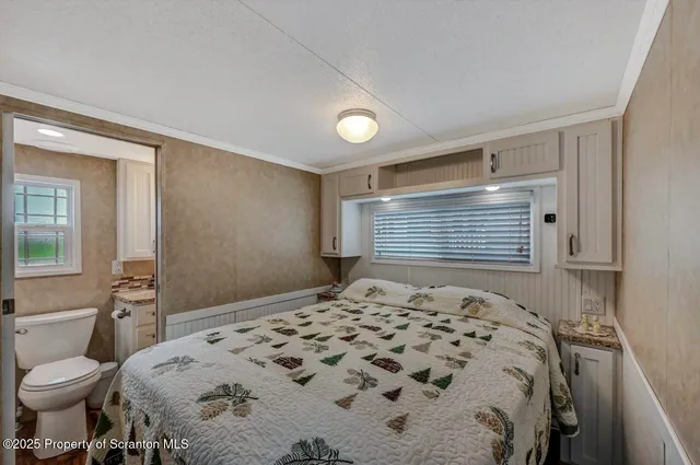 a bathroom with a granite countertop sink a mirror and a bathtub