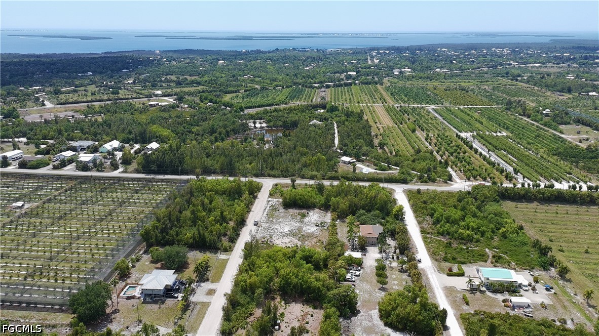 6430 Mannheim Road Bokeelia, FL 33922 - Photo 4 of 9 an aerial view of lake residential houses with outdoor space and lake view