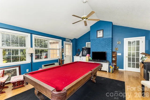 a bed room with a bed and a window