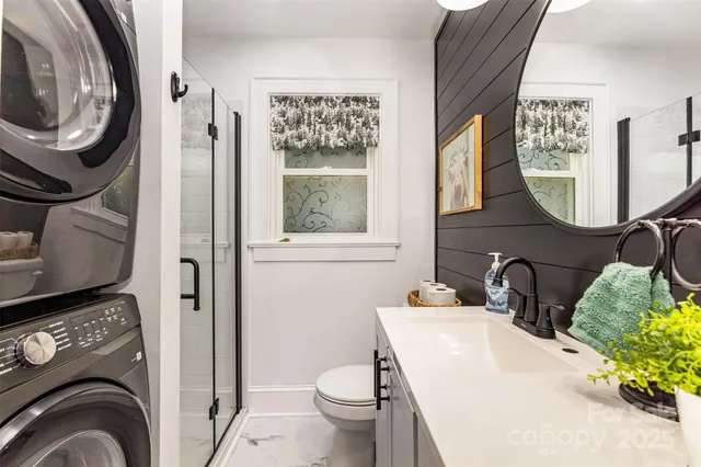 a bathroom with a sink toilet and a mirror