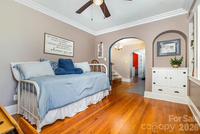 a view of a hallway with a hardwood floor