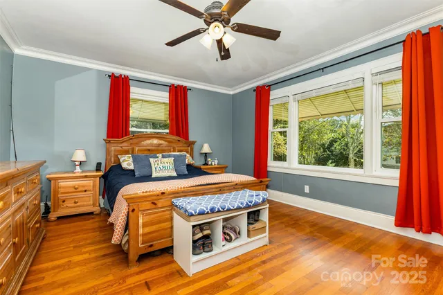 a bed room with a bed and a window