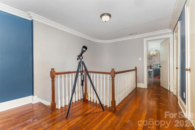 a bedroom with furniture and a chandelier