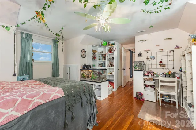 a living room with lots of furniture and a flat screen tv