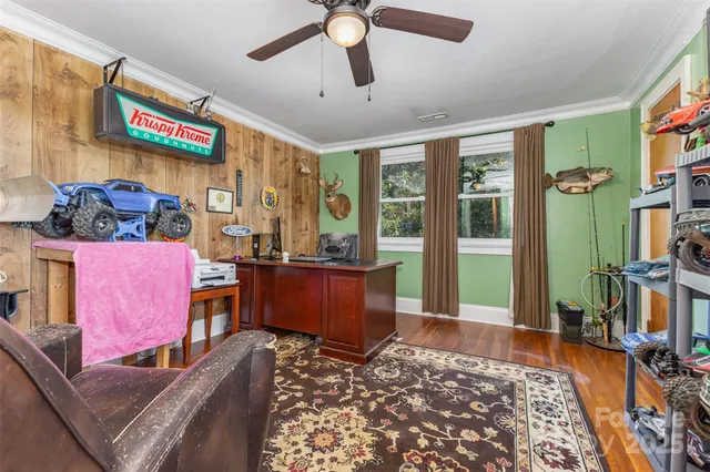 a living room with furniture rug and window