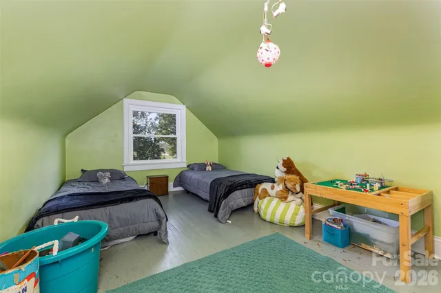 a room with furniture and a flat screen tv