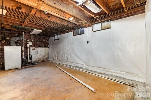 a kitchen with a refrigerator sink and cabinets