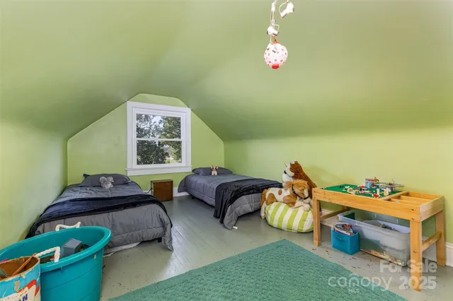 a bedroom with furniture and a window