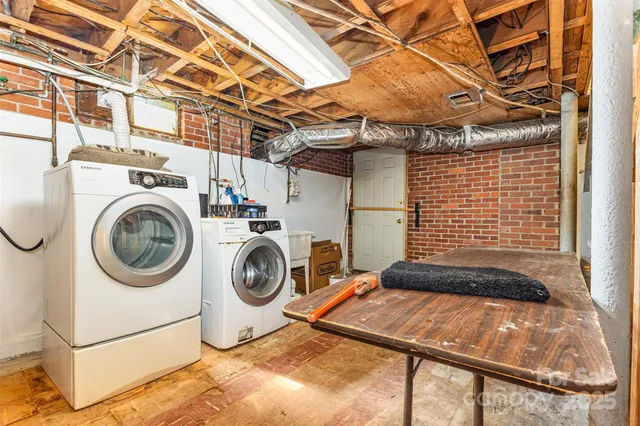 a view of a room with washer and dryer