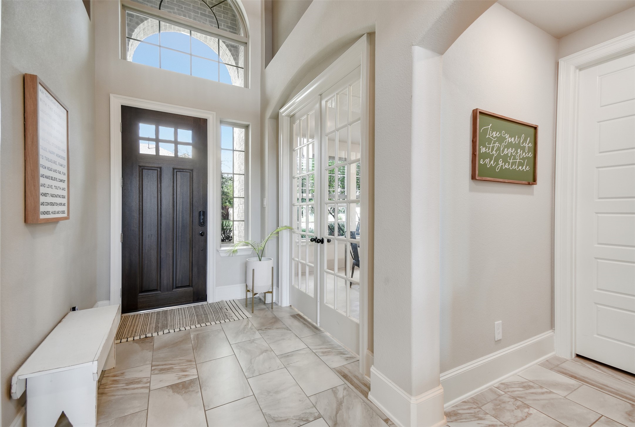 105 Potts Street Georgetown, TX 78628 - Photo 2 of 37 a view of a hallway with wooden floor and windows
