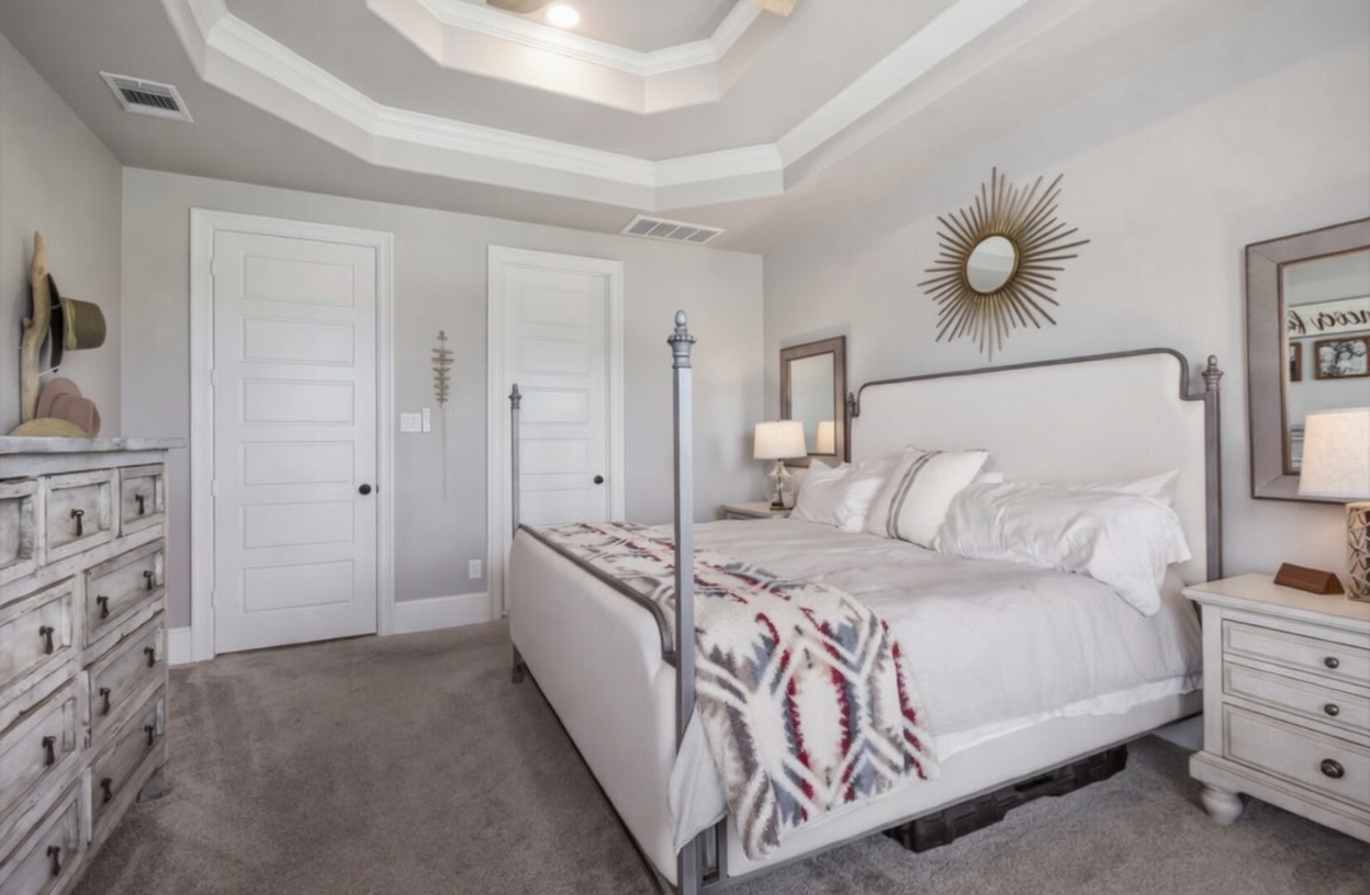 105 Potts Street Georgetown, TX 78628 - Photo 30 of 37 a bedroom with a large bed and a chandelier