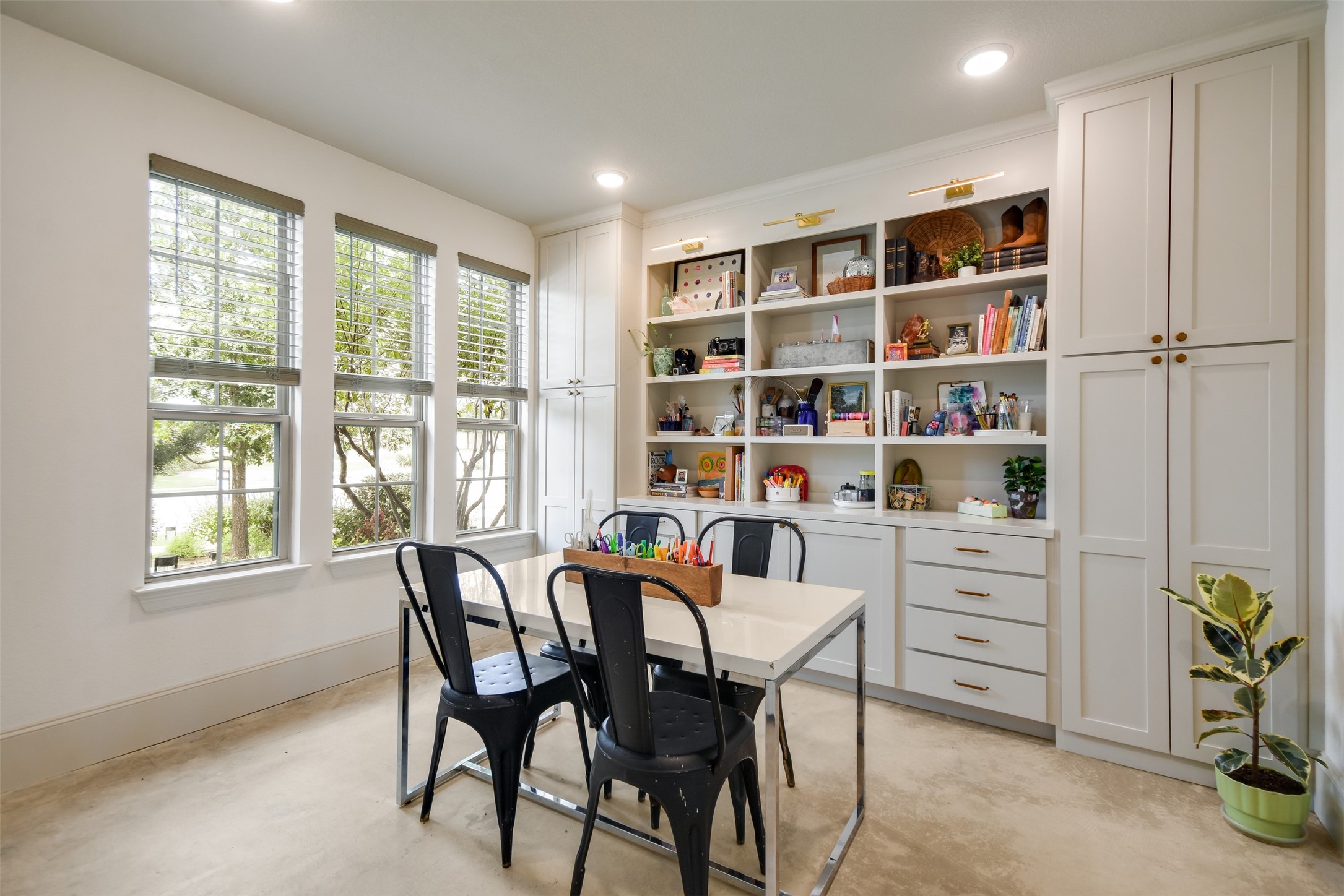105 Potts Street Georgetown, TX 78628 - Photo 3 of 37 a view of a workspace with furniture and a window