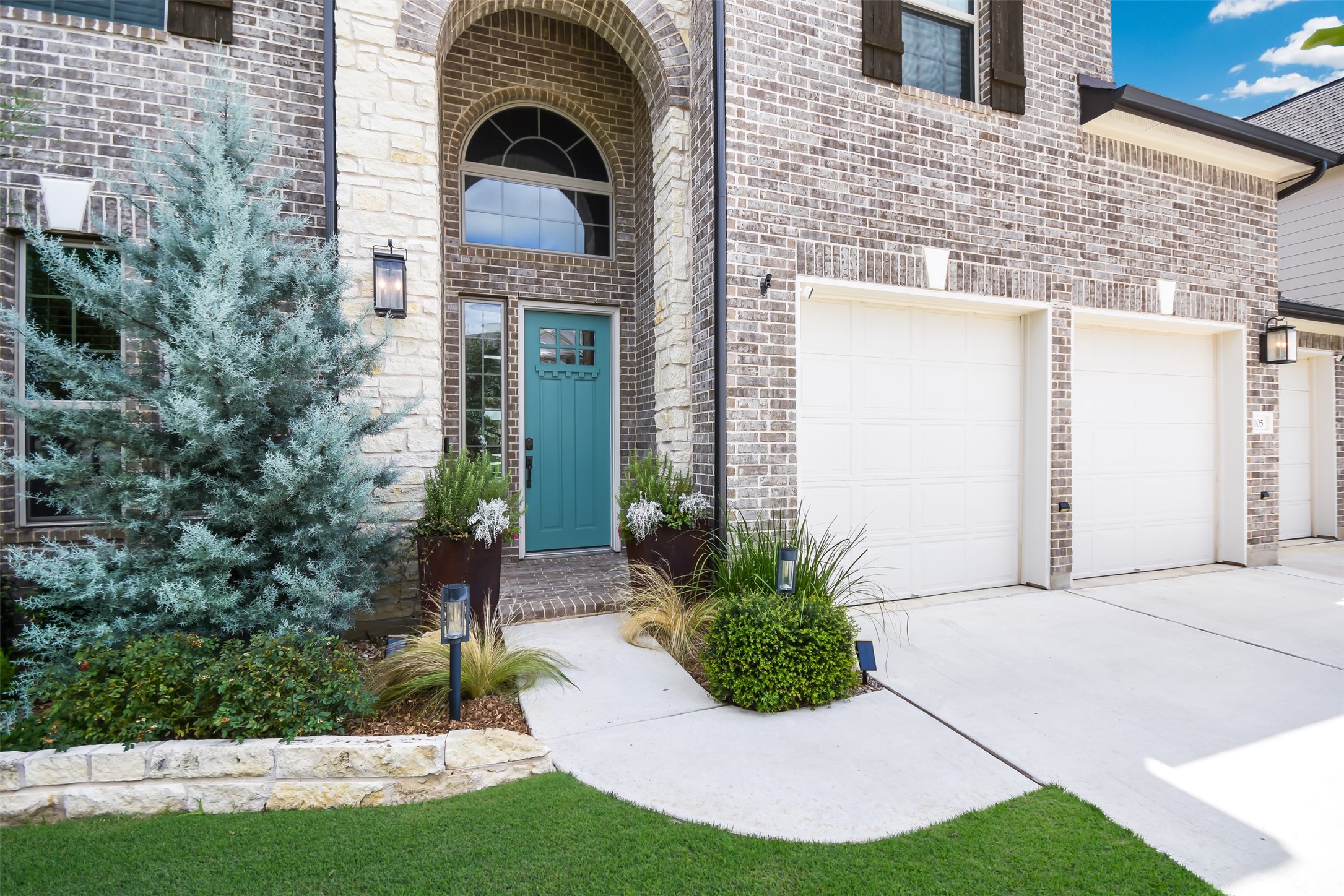 105 Potts Street Georgetown, TX 78628 - Photo 35 of 37 a view of a brick house with a yard and plants