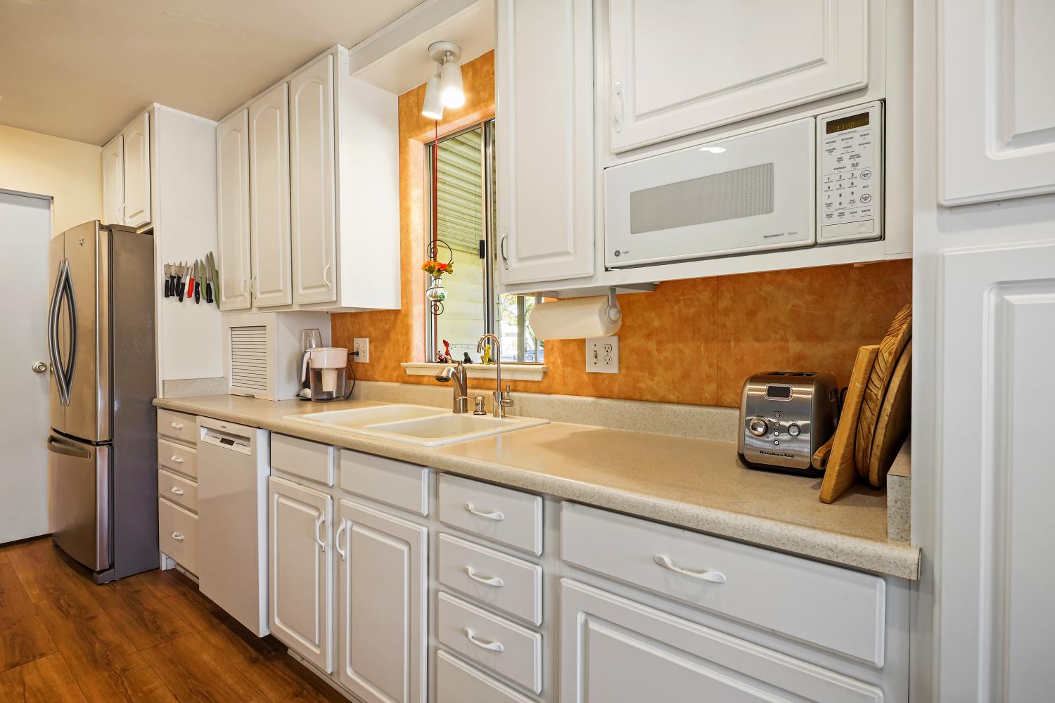 1330 Calaveritas Road, Unit 62 San Andreas, CA 95249 - Photo 12 of 47 a kitchen with sink cabinets and refrigerator