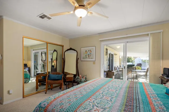 a bed room with a bed and a mirror