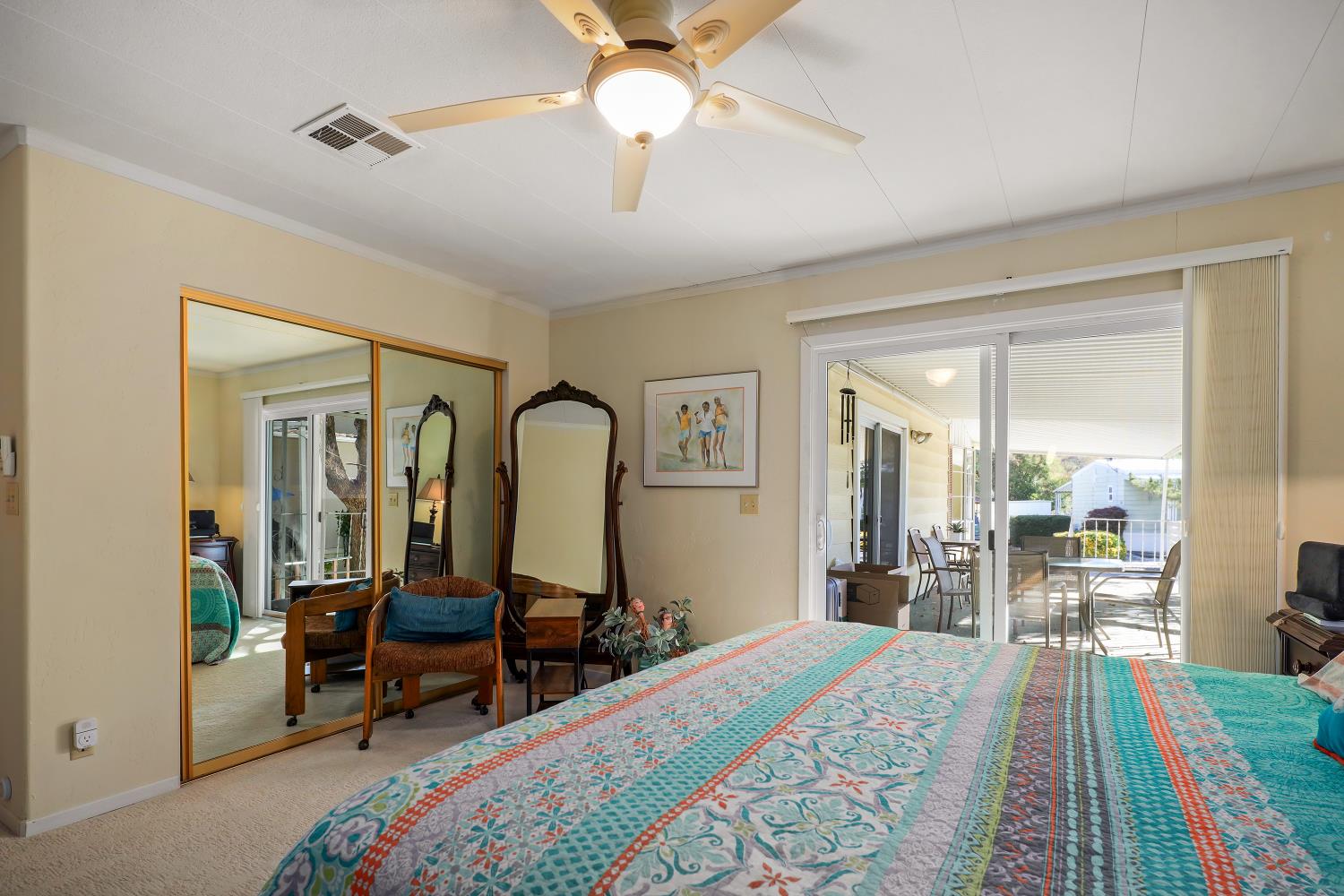 1330 Calaveritas Road, Unit 62 San Andreas, CA 95249 - Photo 26 of 47 a bed room with a bed and a mirror