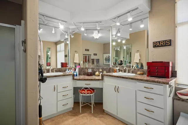 a kitchen with sink and cabinets