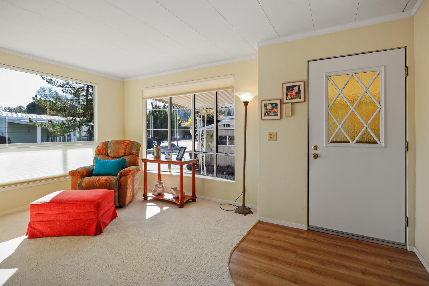 1330 Calaveritas Road, Unit 62 San Andreas, CA 95249 - Photo 3 of 47 a living room with furniture and a floor to ceiling window