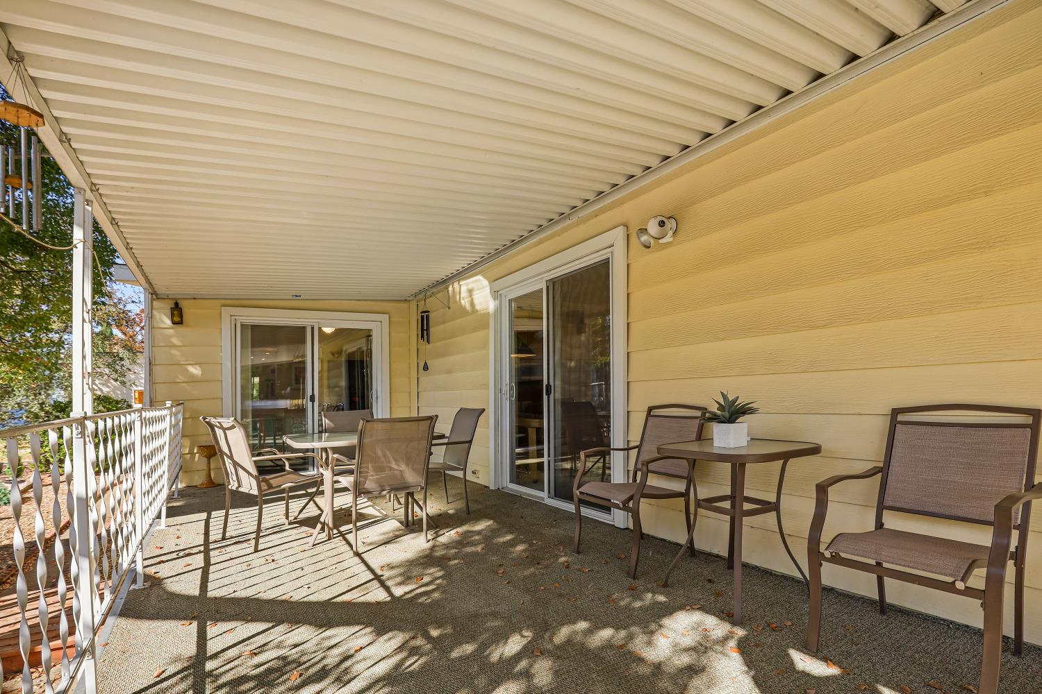 1330 Calaveritas Road, Unit 62 San Andreas, CA 95249 - Photo 32 of 47 a patio with table and chairs and potted plants