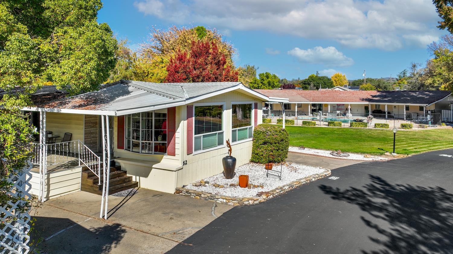 1330 Calaveritas Road, Unit 62 San Andreas, CA 95249 - Photo 41 of 47 a view of a house with a yard patio and a garden
