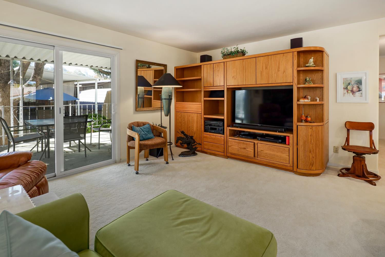 1330 Calaveritas Road, Unit 62 San Andreas, CA 95249 - Photo 5 of 47 THE FAMILY ROOM IS OPEN TO THE KITCHEN AND HAS A SLIDER OUT TO THE EXPANSIVE PATIO AND BUILT-IN ENTERTAINMENT CENTER.
