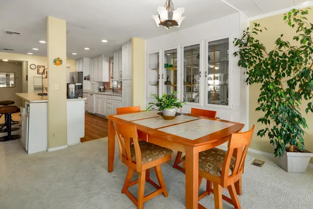 a dining room with furniture and window