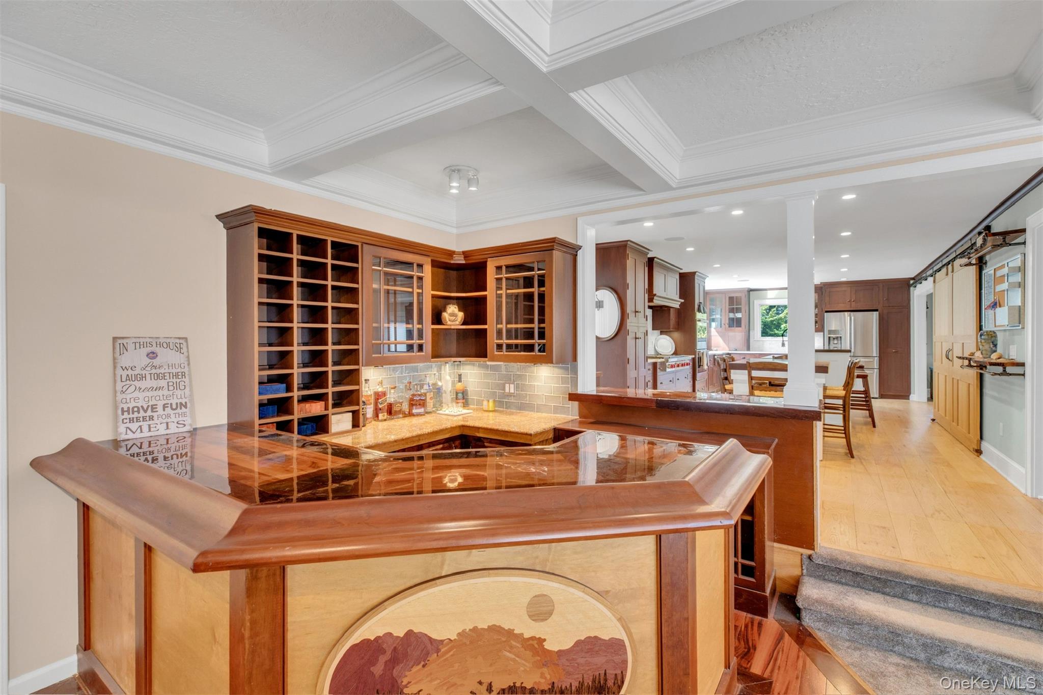 345 Colonial Road Southold, NY 11971 - Photo 14 of 43 a kitchen with a sink a stove and chairs