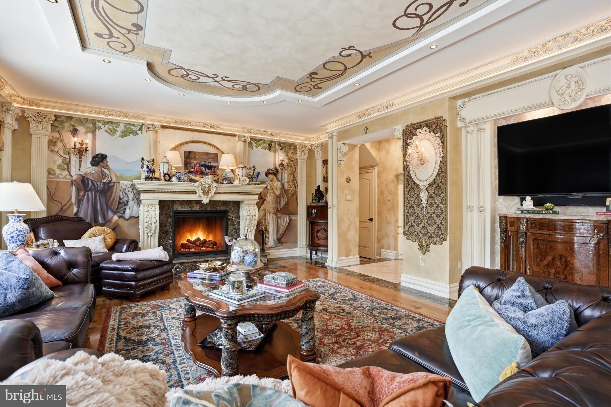 1066 Washington Crossing Road Washington Crossing, PA 18977 - Photo 11 of 92 a living room with furniture a flat screen tv and a fireplace